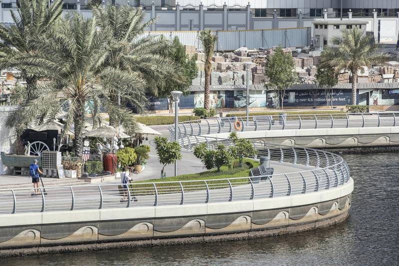 DUBAI, UNITED ARAB EMIRATES. 18 JULY 2020. Dubai Marina Walk now has new signs warning people not to go too fast on their bicycles or e-scooter along the promenade area. (Photo: Antonie Robertson/The National) Journalist: none. Section: National.