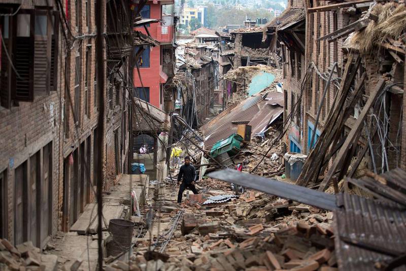 A man walks through rubble in Bhaktapur near Kathmandu. Menahem Kahana / AFP