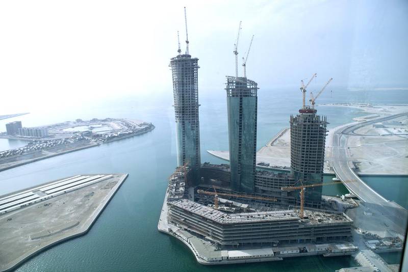 The stalled $650 million project comprises three twisting towers of 54, 52 and 43 storeys, which are to contain a hotel, serviced flats and regular apartments. Razan Alzayani / The National