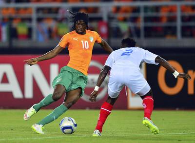 Gervinho, left, of the Ivory Coast takes on Issampa Djos of DR Congo during their African Cup of Nations semi-final at the Bata Stadium in Bata, Equatorial Guinea, on February 4, 2015.  Barry Aldworth / EPA