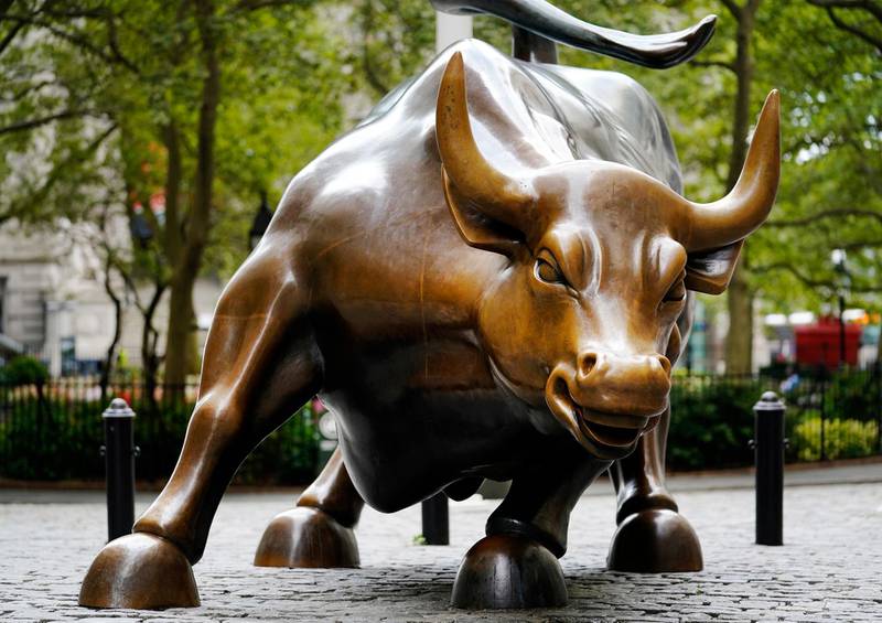 FILE - This Sept. 8, 2020 file photo shows The Charging Bull statue in New York's financial district.  Arturo Di Modica, the artist who sculpted the bronze bull statue in New York, an iconic symbol of Wall Street, has died in his native Sicily.  Di Modica died at his home in Vittoria on Friday, Feb. 19, 2021 the town said in a statement.  (AP Photo/Mark Lennihan, File)