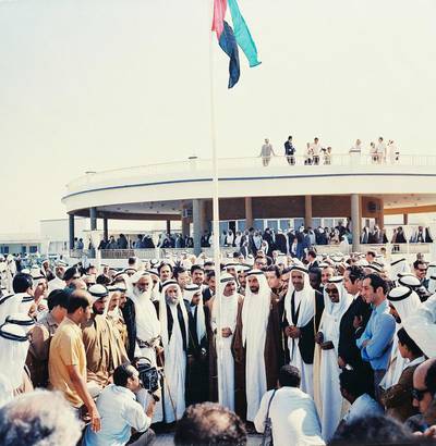 Sheikh Zayed, the Founding Father, and other Rulers gather around the UAE flag at Union House in Dubai on December 2, 1971. It was on this day that the UAE was officially formed. Photo: Alittihad
