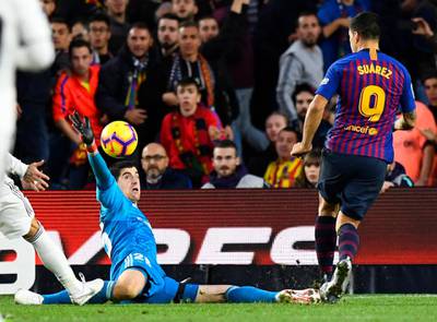 Barcelona's Uruguayan forward Luis Suarez scores his third goal during the Spanish league football match between FC Barcelona and Real Madrid CF at the Camp Nou stadium in Barcelona. AFP