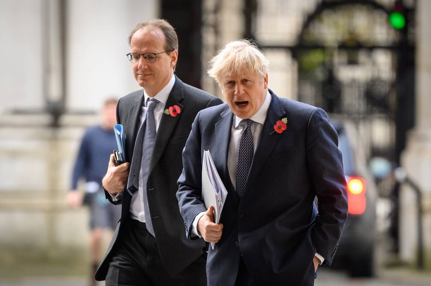 Britain's Prime Minister Boris Johnson is accompanied by Martin Reynolds in Downing Street, November 2020. Photo: Getty