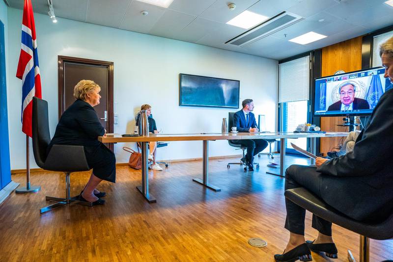 Norwegian Prime Minister Erna Solberg (L) and Minister for Development Aid Dag Inge Ulstein (R) participate in a digital meeting with international leaders about a fair global distribution of Covid-19 vaccines at the the Prime Minister's office in Oslo on 10 September 2020. EPA