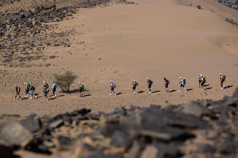The leaders compete amid the blistering Saharan heat.