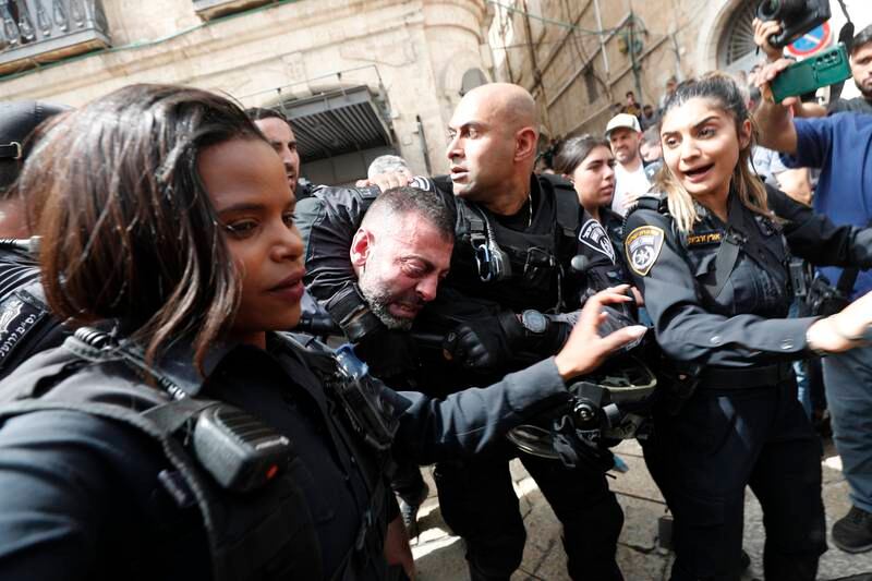 Israeli police arrest a man during the funeral procession in Jerusalem. EPA