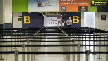 Empty lines ahead of a security gate at Manchester Airport in the UK. Iata's Travel Pass app aims to help facilitate travel in a safe and secure manner that meets Covid-19 screening requirements of countries. Getty