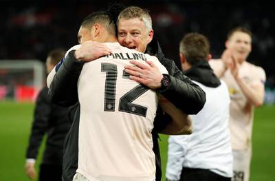 Manchester United interim manager Ole Gunnar Solskjaer and Manchester United's Chris Smalling celebrate. Reuters