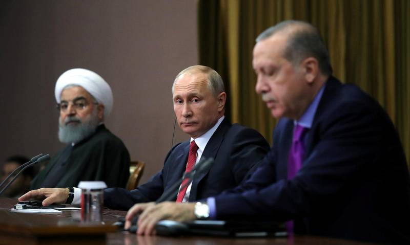 Iran's President Hassan Rouhani together with his counterparts Russia's Vladimir Putin and Turkey's Tayyip Erdogan attend a joint news conference following their meeting in Sochi, Russia November 22, 2017. Sputnik/Mikhail Klimentyev/Kremlin via REUTERS ATTENTION EDITORS - THIS IMAGE WAS PROVIDED BY A THIRD PARTY.
