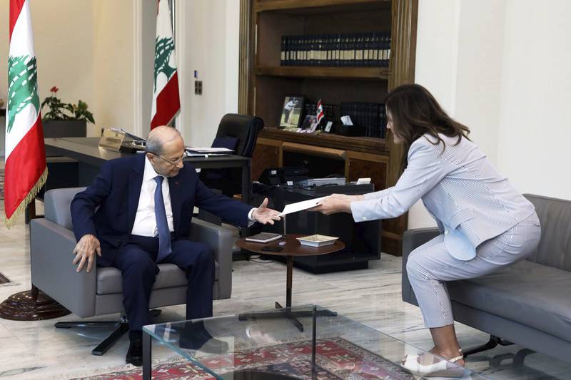 Lebanese President Michel Aoun receives the proposals document from US ambassador Dorothy Shea on Saturday. AP