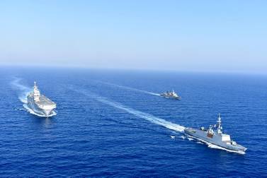 The French Tonnerre helicopter carrier is escorted by Greek and French military vessels during a maritime exercise in the Eastern Mediterranean. Greek National Defence/AP