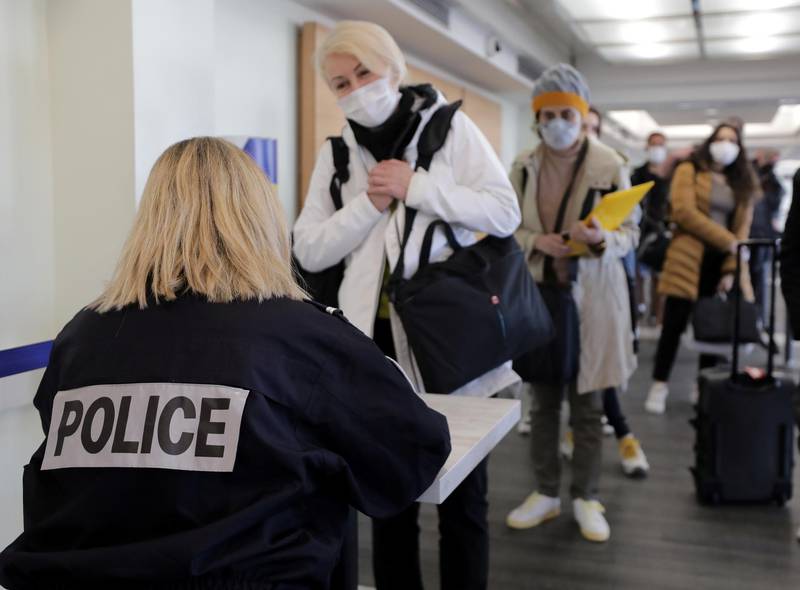 A French border police officer checks passengers as they arrive at Nice Cote d'Azur Airport in Nice, France. Reuters
