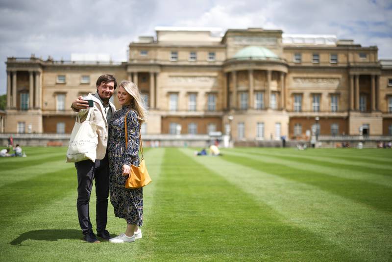 People take a selfie in the The Garden of Buckingham Palace, during a preview day before it opens to the public. Reuters