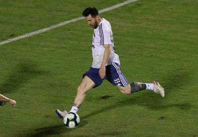 Messi gets a shot away during training. Reuters