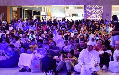 Fans at Yas Mall in Abu Dhabi watch Manchester City beat Inter Milan to win the Champions League final. Khushnum Bhandari / The National