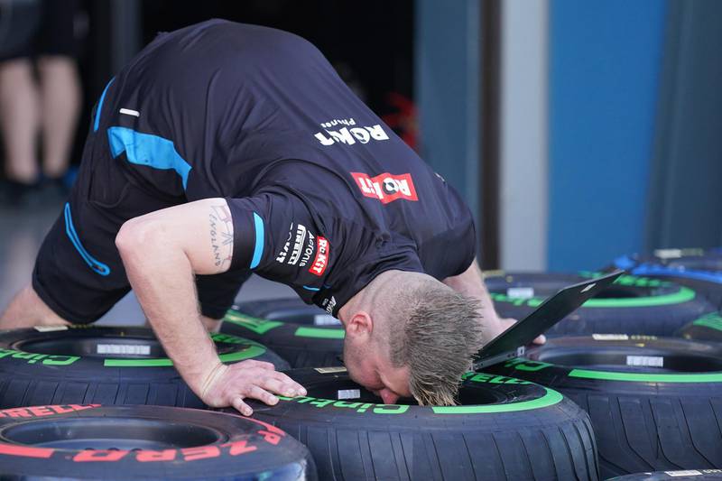 A mechanic checks tyres ahead of the Formula 1 Australian Grand Prix 2020.