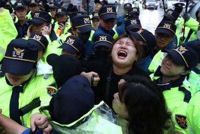 Protesters in Seoul scuffle with police during a rally against the Japanese government's decision to release treated radioactive water into the Pacific Ocean. Getty Images