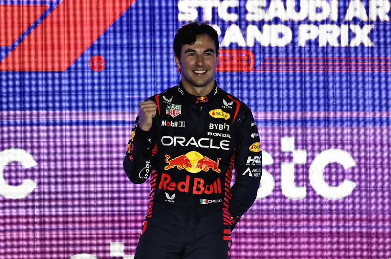 Sergio Perez celebrates on the podium. Reuters