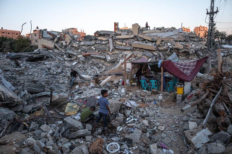 Life resumes amid the rubble of destroyed homes in Beit Hanoun, Gaza. Getty