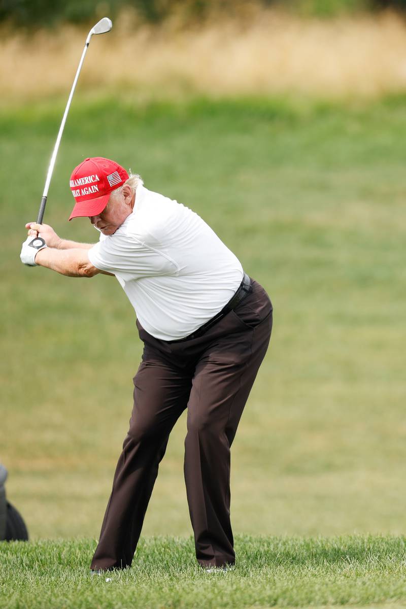 Mr Trump on the first hole. AFP