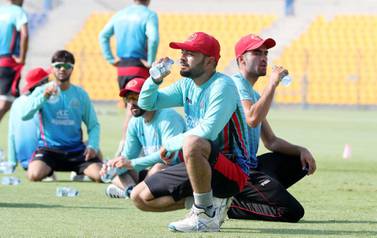 Afghanistan captain Rashid Khan, pictured during training at the Zayed Cricket Stadium in Abu Dhabi ahead of their tour to Bangladesh, hit a half century and took four wickets in the one-off Test on Friday. ​​​​Pawan Singh / The National