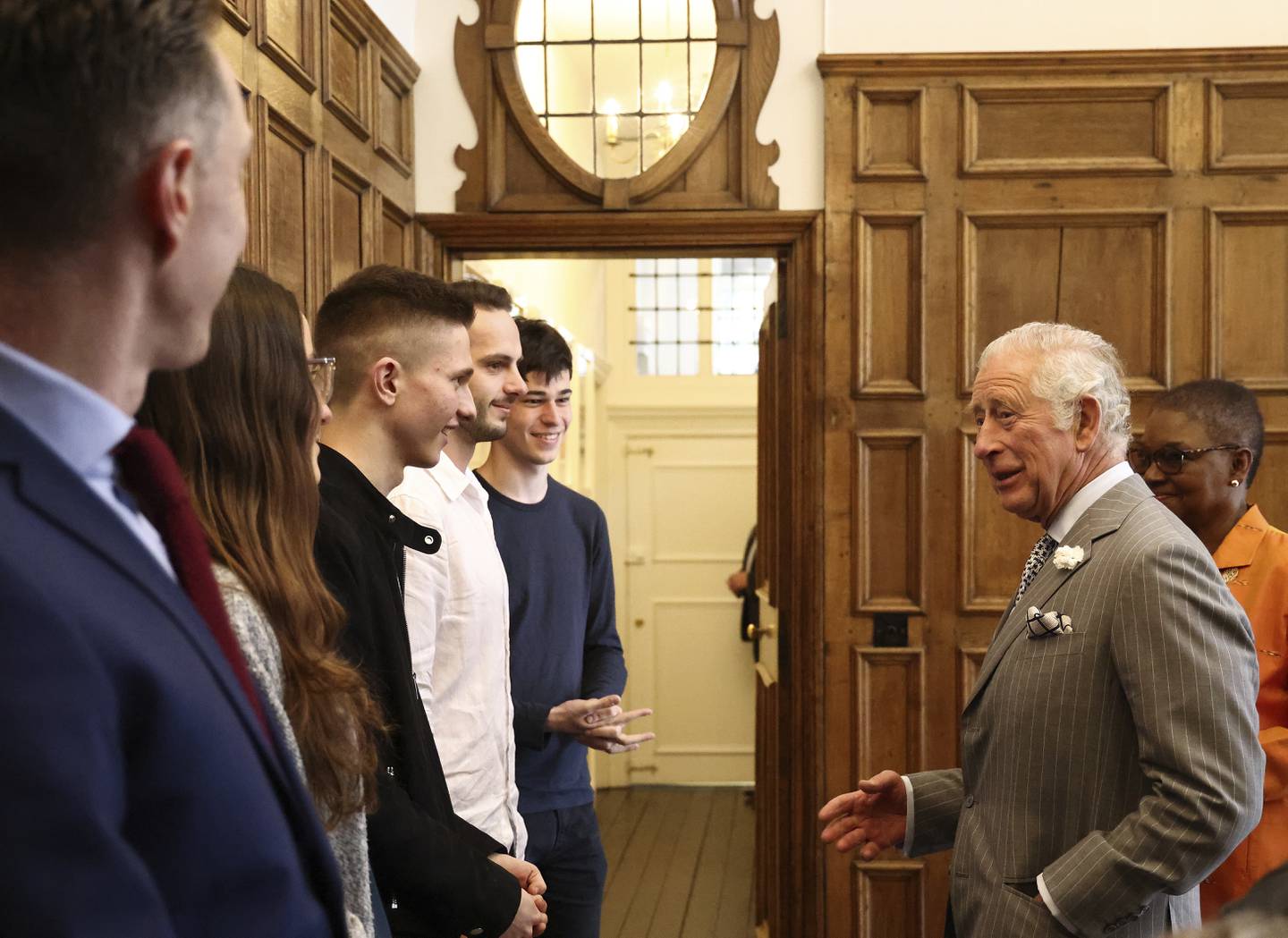 Britain's King Charles joins a discussion with students at University College, Oxford. AP