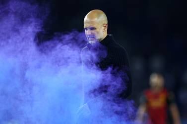 BRIGHTON, ENGLAND - MAY 24: Pep Guardiola, Manager of Manchester City, reacts in the smoke from a flare on the pitch after the Premier League match between Brighton & Hove Albion and Manchester City at American Express Community Stadium on May 24, 2023 in Brighton, England. (Photo by Clive Rose / Getty Images)