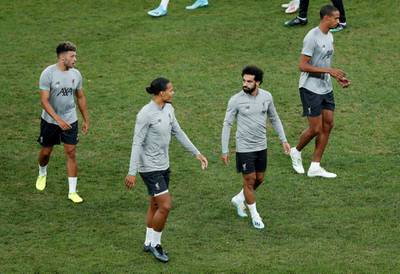 Salah, van Dijk and Oxlade-Chamberlain with team mates during training. Reuters