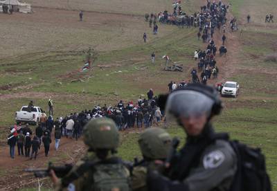 Israeli security forces monitor Palestinian demonstrators protesting near the West Bank village of Tubas, near the Jordan Valley, in the occupied West Bank on January 29, 2020. AFP