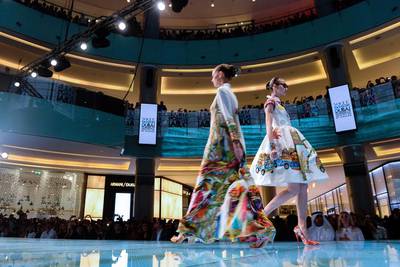 Models walk the runway during the Vogue Fashion Dubai Experience in 2014. Getty Images for Vogue & The Dubai Mall