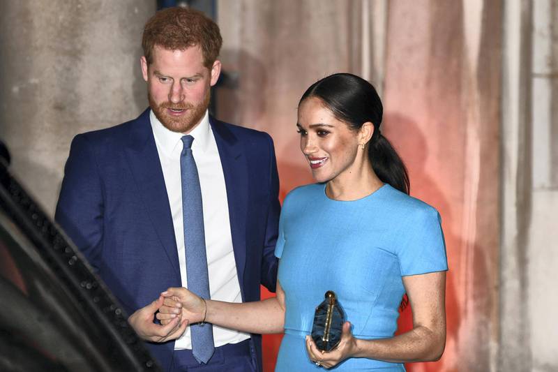 Britain's Prince Harry, Duke of Sussex (L), and Meghan, Duchess of Sussex leave after attending the Endeavour Fund Awards at Mansion House in London on March 5, 2020. - The Endeavour Fund helps servicemen and women have the opportunity to rediscover their self-belief and fighting spirit through physical challenges. (Photo by DANIEL LEAL-OLIVAS / AFP)