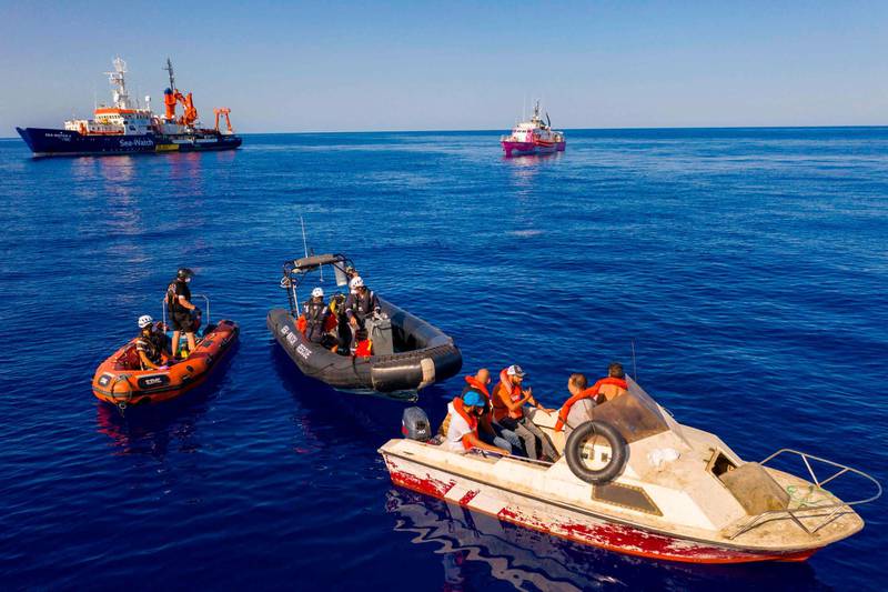 Three small rescue boats from the civil sea rescue ship Sea-Watch 4, left, and the Louise Michel, right, a rescue boat funded by the British artist Banksy, off the coast of Libya on August 22, 2020. AFP