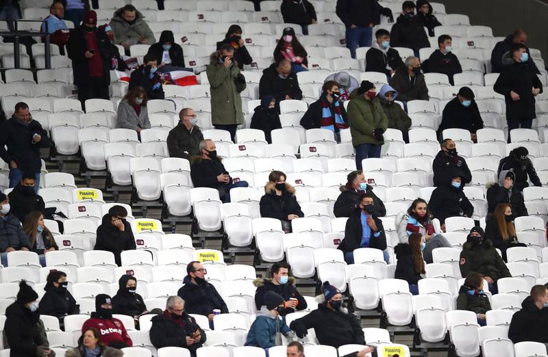 Fans are socially distanced as they wait for kick off at the London Stadium in London, England.  AP