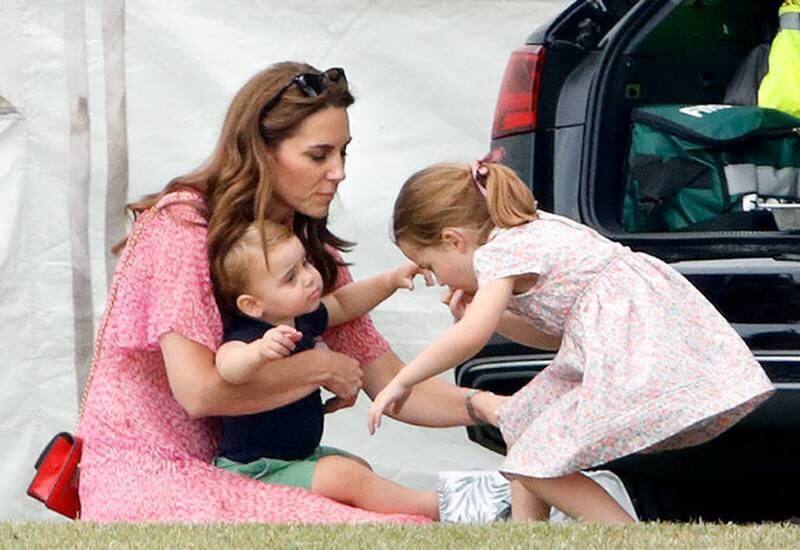 WOKINGHAM, UNITED KINGDOM - JULY 10: (EMBARGOED FOR PUBLICATION IN UK NEWSPAPERS UNTIL 24 HOURS AFTER CREATE DATE AND TIME) Catherine, Duchess of Cambridge, Prince Louis of Cambridge and Princess Charlotte of Cambridge attend the King Power Royal Charity Polo Match, in which Prince William, Duke of Cambridge and Prince Harry, Duke of Sussex were competing for the Khun Vichai Srivaddhanaprabha Memorial Polo Trophy at Billingbear Polo Club on July 10, 2019 in Wokingham, England. (Photo by Max Mumby/Indigo/Getty Images)