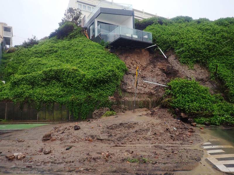 A house is seen after a landslip took out part of its foundation, forcing the road to be closed in Shortland esplanade, Newcastle, New South Wales. EPA