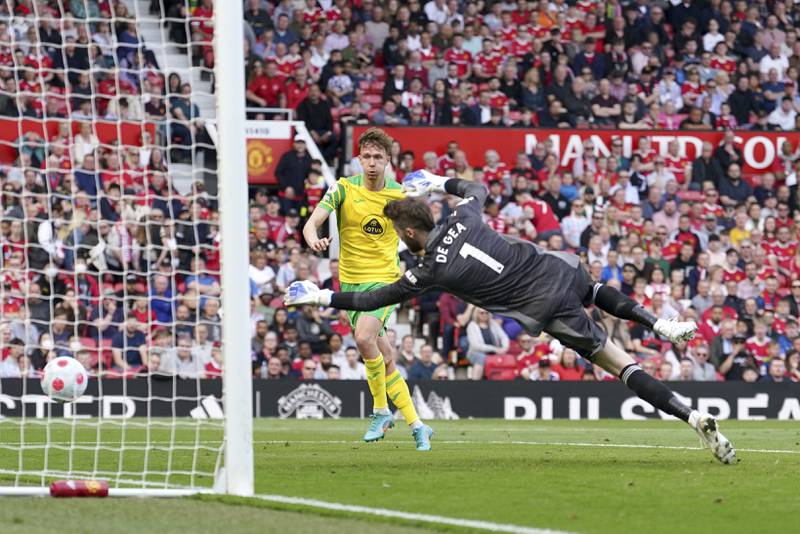 Norwich City's Kieran Dowell scores past goalkeeper David de Gea. AP