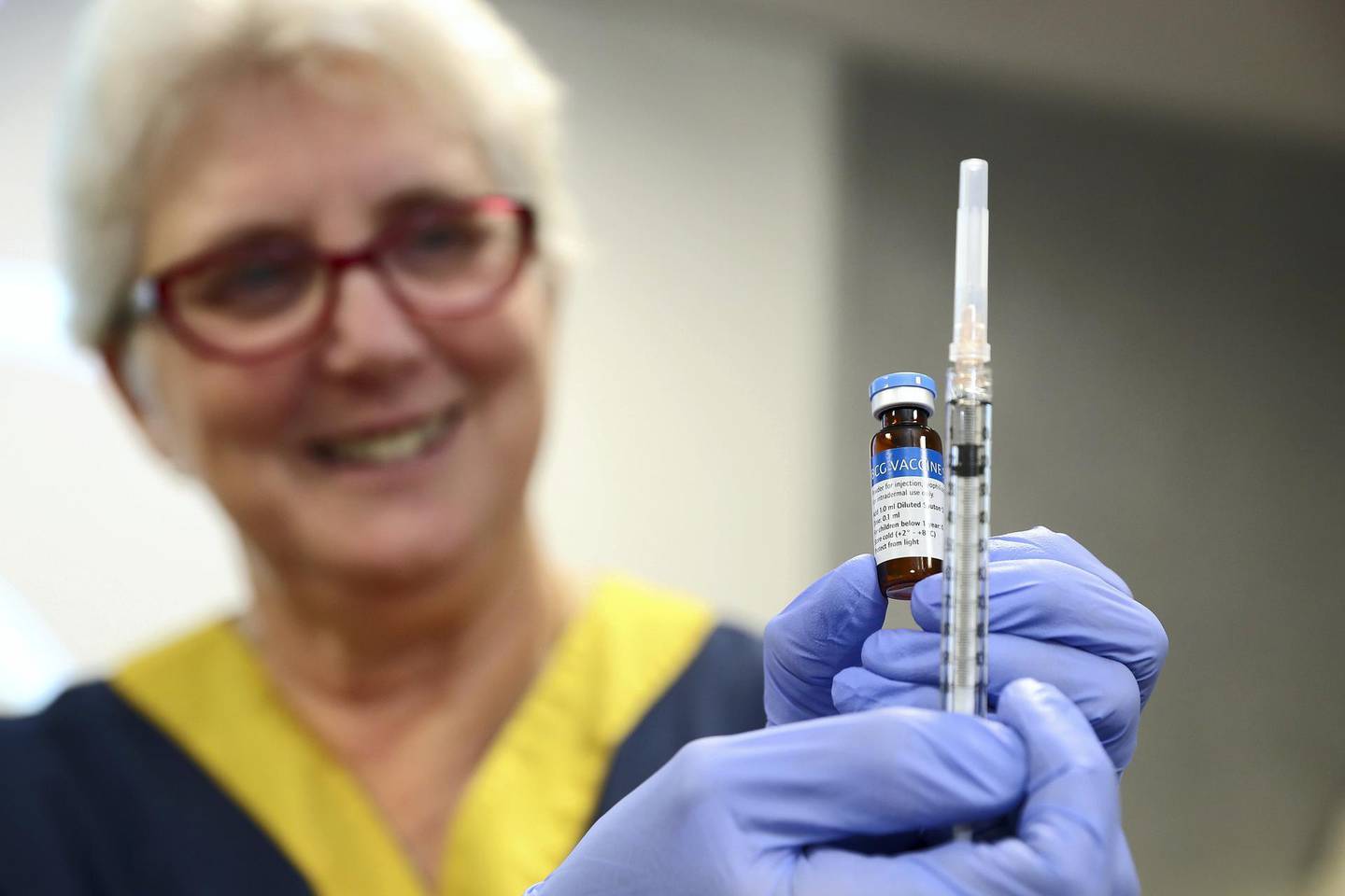 PERTH, AUSTRALIA - APRIL 20: A clinical staff member holds a BCG vial and syringe in the trial clinic at Sir Charles Gairdner hospital on April 20, 2020 in Perth, Australia. Healthcare workers in Western Australia are participating in a new trial to test whether an existing tuberculosis vaccine can help reduce their chances of contracting COVID-19. 2000 frontline staff from Fiona Stanley, Sir Charles Gairdner and Perth Children's Hospital are taking part in the research trial, which will see half of participants receiving the existing Bacillus Calmette-GuÃ©rin (BCG) vaccine in addition to their flu vaccine, while the other half receive the regular flu shot. The BCG vaccine was originally developed to work against tuberculosis, but it is hoped it might help reduce the chance of contracting coronavirus as well as lessen the severity of symptoms and boost immunity in the long term. The BRACE trial is being led by by the Murdoch Children's Research Institute. (Photo by Paul Kane/Getty Images)