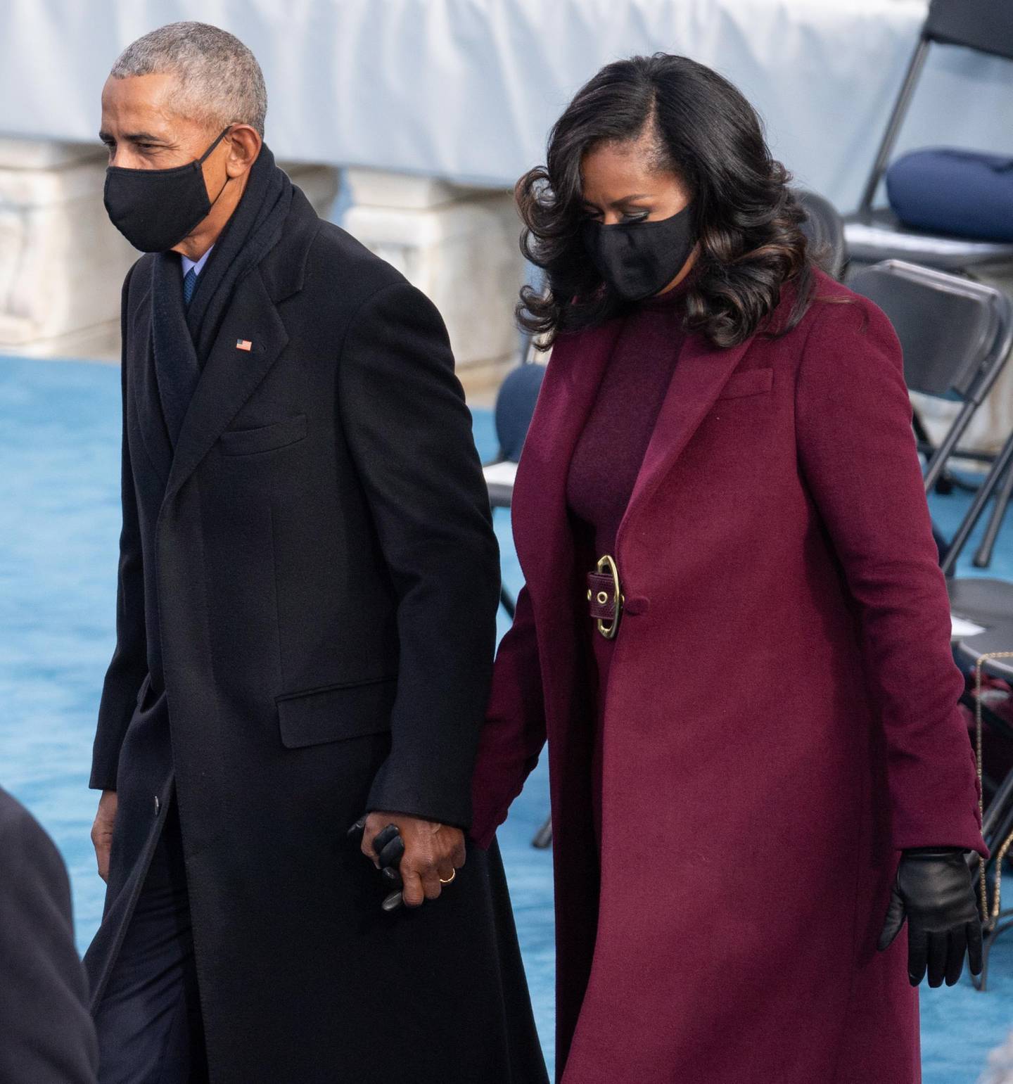 epa08953815 Former US President Barack Obama and Former US First Lady Michelle Obama arrive during the inauguration of Joe Biden as US President in Washington, DC, USA, 20 January 2021. Biden won the 03 November 2020 election to become the 46th President of the United States of America.  EPA/SAUL LOEB / POOL