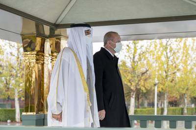 Sheikh Mohamed and Mr Erdogan stand as the two countries' national anthems are played at the Presidential Complex.  Mohamed Al Hammadi / Ministry of Presidential Affairs