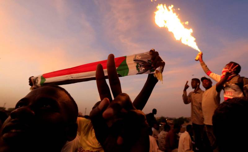A Sudanese demonstrator gestures as he attends a sit-in protest outside the Defence Ministry in Khartoum. Reuters