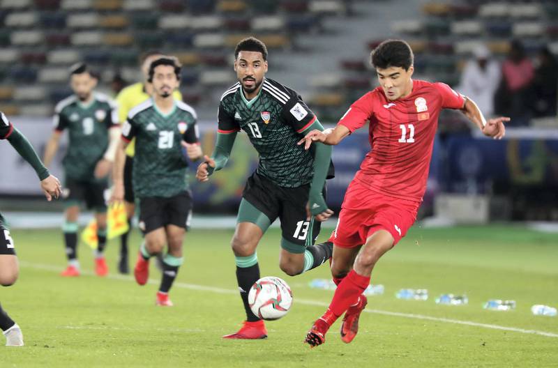 ABU DHABI , UNITED ARAB EMIRATES , January 21 – 2019 :- Khamis Esmaeel Zayed ( no 13 in green UAE ) and Sagynbaev Bekzhan ( no 11 in red of Kyrgyz Republic ) in action during the AFC Asian Cup UAE 2019 football match between UNITED ARAB EMIRATES vs. KYRGYZ REPUBLIC held at Zayed Sports City in Abu Dhabi. ( Pawan Singh / The National ) For News/Sports
