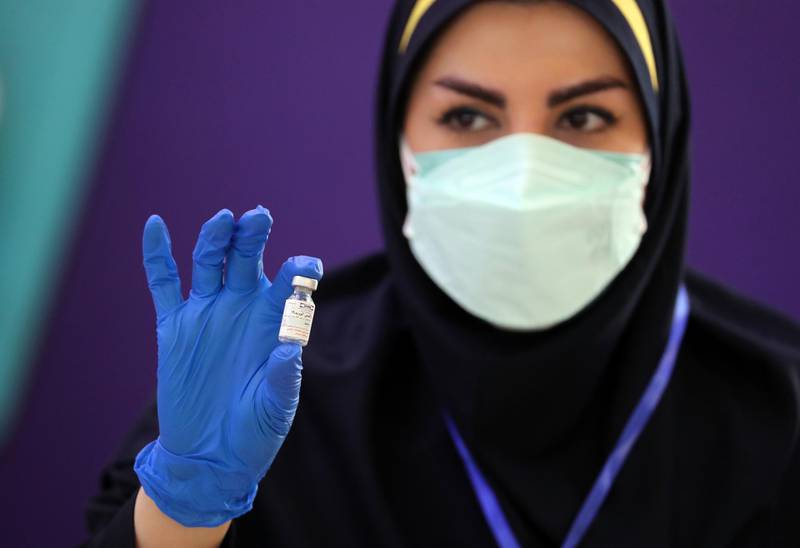 epa09157853 An Iranian health worker shows a dose of the locally-made 'COVIRAN Barekat' at the beginning of the third phases of the human test of the vaccine, in Tehran, Iran, 25 April 2021. Phases three of clinical trials of the locally-made COVID-19 vaccine began on 25 March, after the second phase of human trials took place on 15 March. According to Mohammad Mokhber, the head of COVIRAN Barekat vaccine department, the vaccine will be ready in summer 2021 for massive vaccination in Iran.  EPA-EFE/ABEDIN TAHERKENAREH