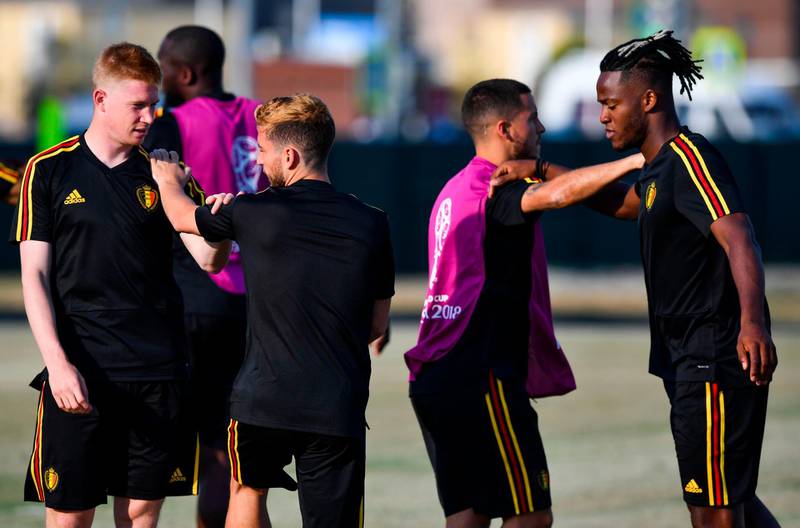 CORRECTION / L to R, Belgium's midfielder Kevin De Bruyne, Belgium's defender Thomas Meunier, Belgium's forward Eden Hazard and Belgium's forward Michy Batshuayi stretch during a training session at the Olympic Park Arena in Sochi on June 17, 2018, on the eve of the Russia 2018 World Cup Group G football match between Belgium and Panama. / AFP / Nelson Almeida
