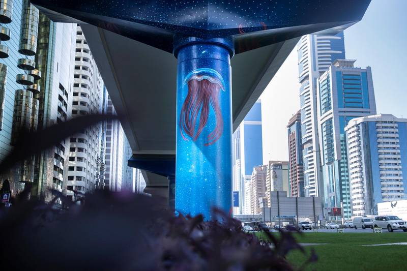 DUBAI, UNITED ARAB EMIRATES - NOVEMBER 12, 2018. The Dubai Metro Murals Project.This initiative, run by Brand Dubai, will see some of the pillars that hold up the Dubai Metro painted by two international artists, Peruvian Daniel Cortez and Dominican-born, Miami-based Elio Mercado, known as Evoca1. These two artists will paint the pillars in between the DIFC and Emirates Towers stations.(Photo by Reem Mohammed/The National)Reporter: Section:  NA