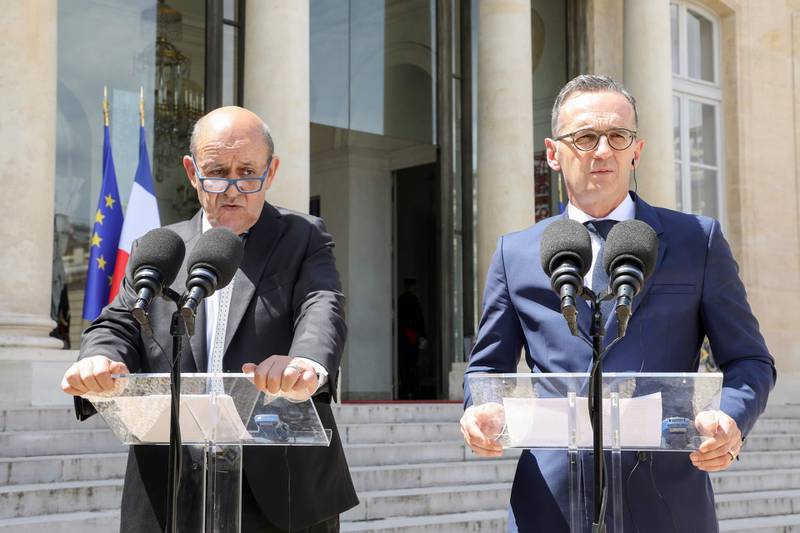 French Foreign Affairs Minister Jean-Yves Le Drian (L) and German Foreign Affairs Minister Heiko Maas adress a press conference at the Elysee presidential palace after attending the weekly Cabinet meeting on June 19, 2019 in Paris. / AFP / LUDOVIC MARIN
