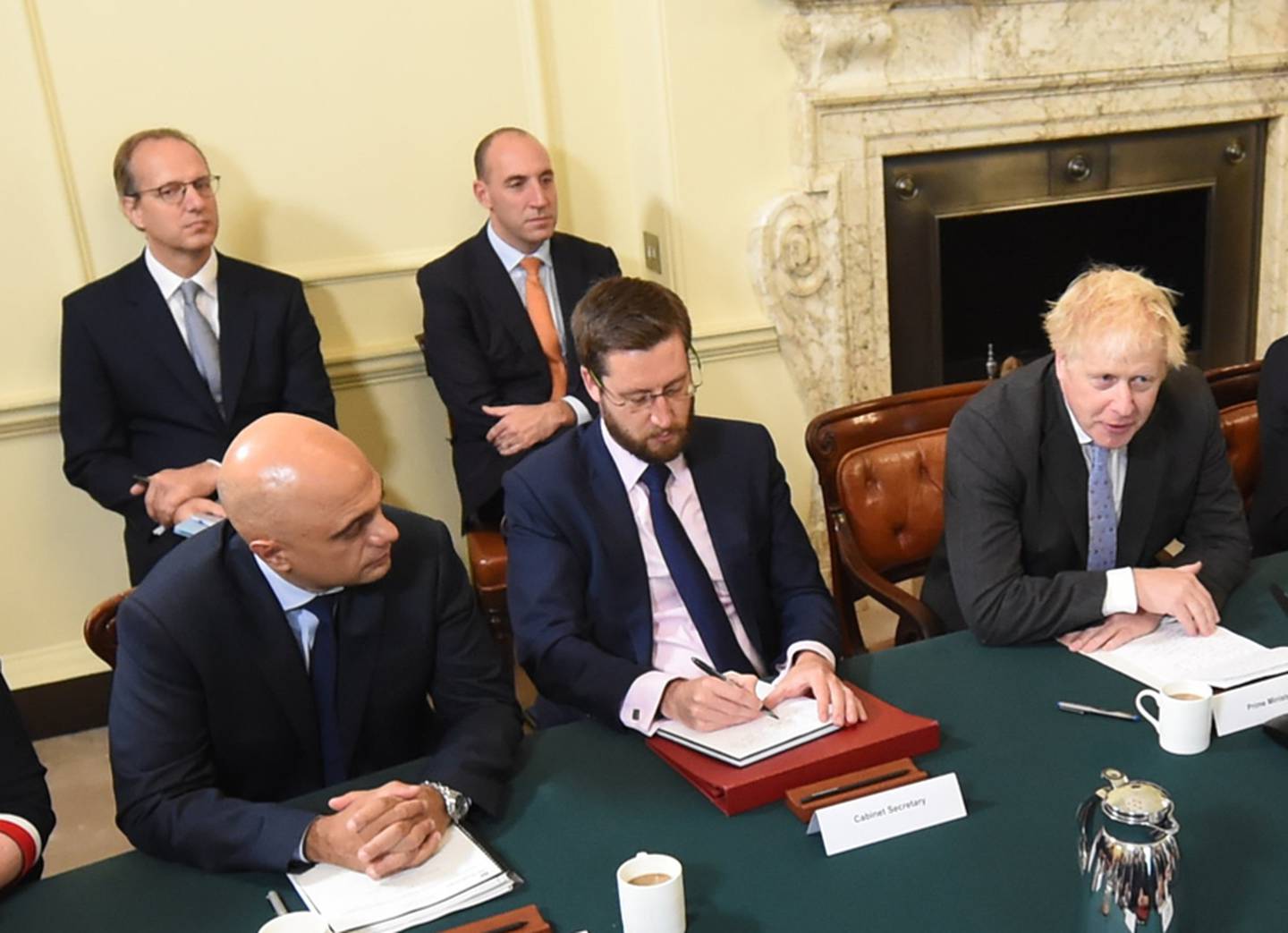 Martin Reynolds, the prime minister's principal private secretary, seated back left, is expected to be purged from Downing Street as part of a mass clear-out of aides. PA