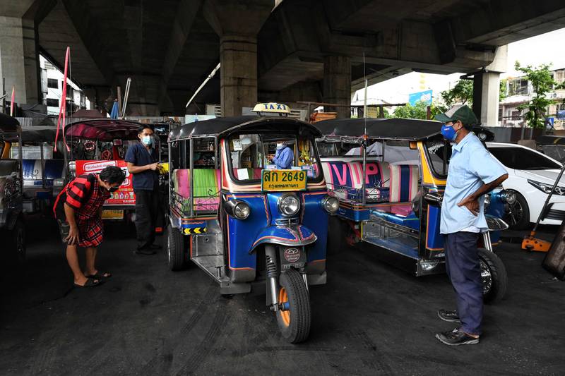 Bangkok's tuk-tuks are gearing up for a return of business as the country further opens to incoming foreign tourism. Photo by Lillian Suwanrumpha / AFP